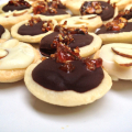 Mini Dark Chocolate and White Chocolate Ganache Tarts with Hazelnut Brittle and Almonds