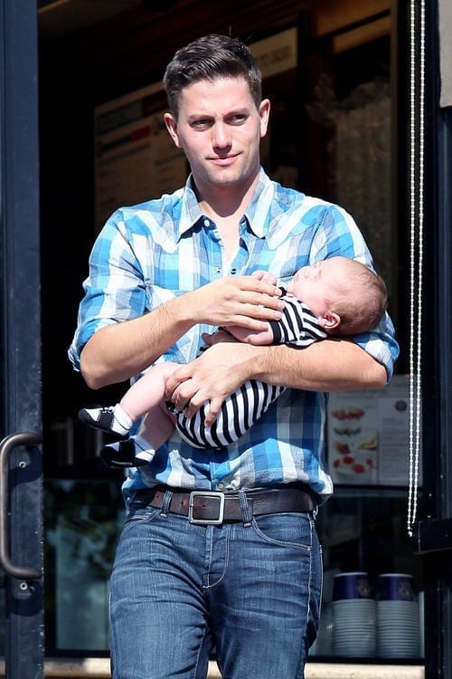 Jackson Rathbone cradles one month old son Monroe while on a morning java run with girlfriend Sheila Hafsadi in LA