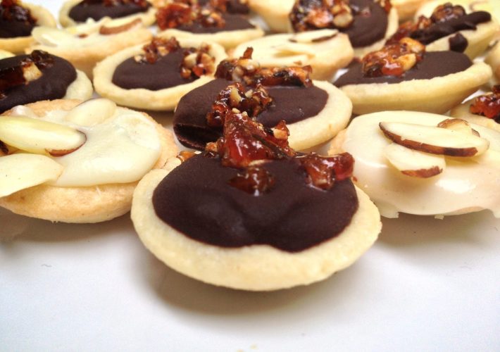 Mini Dark Chocolate and White Chocolate Ganache Tarts with Hazelnut Brittle and Almonds